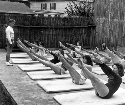 Joseph Pilates leading a body conditioning class on the Tea Garden platform, ca. 1943